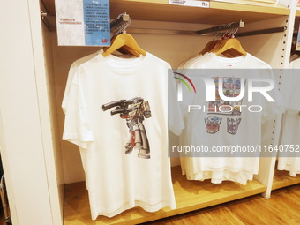 Transformers x UNIQLO co-branded custom T-shirts are displayed at the Uniqlo flagship store in Shanghai, China, on October 4, 2024. This yea...