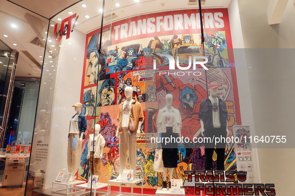 Transformers x UNIQLO co-branded custom T-shirts are displayed at the Uniqlo flagship store in Shanghai, China, on October 4, 2024. This yea...