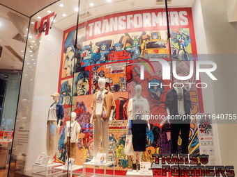 Transformers x UNIQLO co-branded custom T-shirts are displayed at the Uniqlo flagship store in Shanghai, China, on October 4, 2024. This yea...