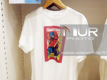 Transformers x UNIQLO co-branded custom T-shirts are displayed at the Uniqlo flagship store in Shanghai, China, on October 4, 2024. This yea...