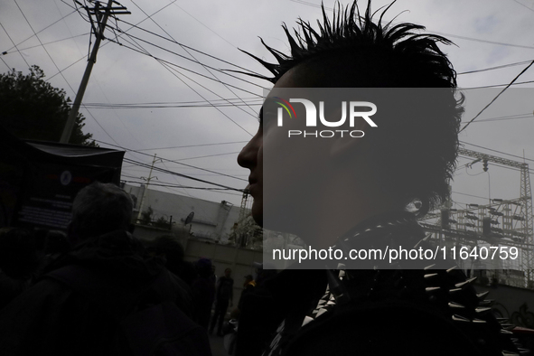 A young man attends a concert during the 44th anniversary of the Tianguis Cultural del Chopo in Mexico City, Mexico, on October 5, 2024, a p...