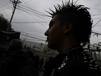 A young man attends a concert during the 44th anniversary of the Tianguis Cultural del Chopo in Mexico City, Mexico, on October 5, 2024, a p...