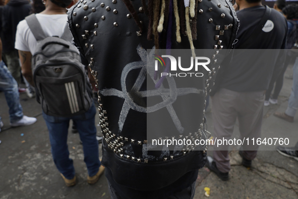 A young man attends a concert during the 44th anniversary of the Tianguis Cultural del Chopo in Mexico City, Mexico, on October 5, 2024, a p...