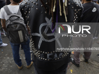 A young man attends a concert during the 44th anniversary of the Tianguis Cultural del Chopo in Mexico City, Mexico, on October 5, 2024, a p...