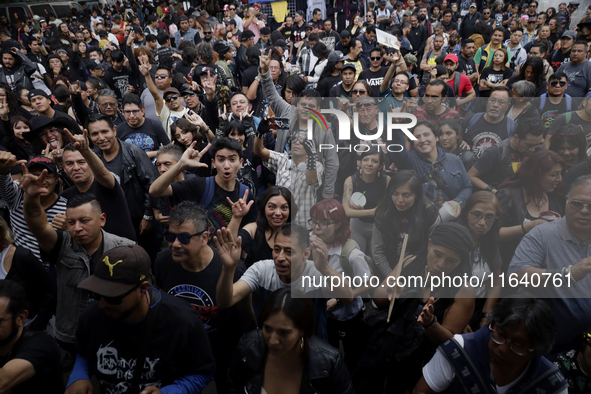 Young people attend a concert during the 44th anniversary of the Tianguis Cultural del Chopo in Mexico City, Mexico, on October 5, 2024, a p...