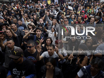 Young people attend a concert during the 44th anniversary of the Tianguis Cultural del Chopo in Mexico City, Mexico, on October 5, 2024, a p...