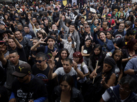 Young people attend a concert during the 44th anniversary of the Tianguis Cultural del Chopo in Mexico City, Mexico, on October 5, 2024, a p...