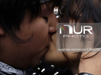 Two young people kiss during a concert on the occasion of the 44th anniversary of the Tianguis Cultural del Chopo in Mexico City, Mexico, on...