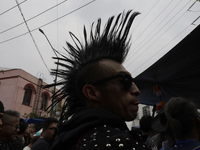 A young man attends a concert during the 44th anniversary of the Tianguis Cultural del Chopo in Mexico City, Mexico, on October 5, 2024, a p...