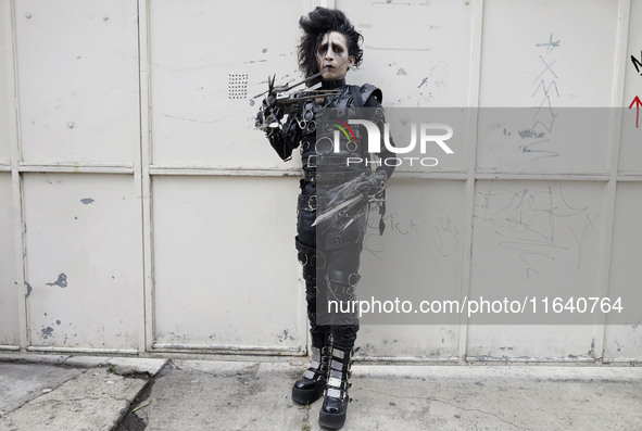 A young man dresses as the Scissorhands Man during a concert on the occasion of the 44th anniversary of the Tianguis Cultural del Chopo in M...