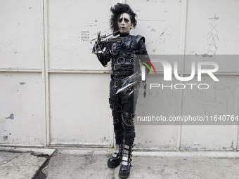 A young man dresses as the Scissorhands Man during a concert on the occasion of the 44th anniversary of the Tianguis Cultural del Chopo in M...