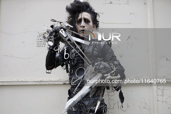 A young man dresses as the Scissorhands Man during a concert on the occasion of the 44th anniversary of the Tianguis Cultural del Chopo in M...