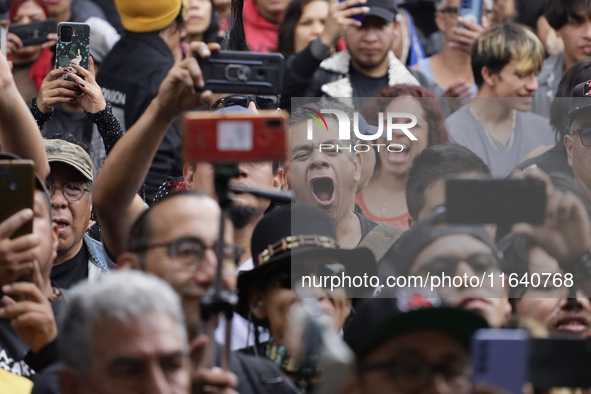 Young people dance during a concert to mark the 44th anniversary of the Tianguis Cultural del Chopo in Mexico City, Mexico, on October 5, 20...