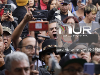 Young people dance during a concert to mark the 44th anniversary of the Tianguis Cultural del Chopo in Mexico City, Mexico, on October 5, 20...