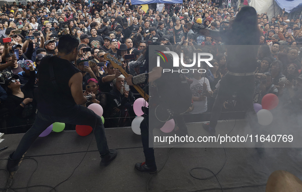 Members of the band Transmetal offer a concert on the occasion of the 44th anniversary of the Tianguis Cultural del Chopo in Mexico City, Me...