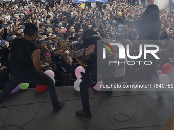 Members of the band Transmetal offer a concert on the occasion of the 44th anniversary of the Tianguis Cultural del Chopo in Mexico City, Me...