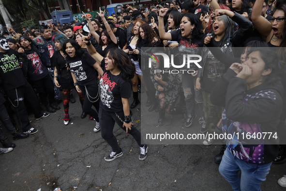 Young people dance during a concert to mark the 44th anniversary of the Tianguis Cultural del Chopo in Mexico City, Mexico, on October 5, 20...