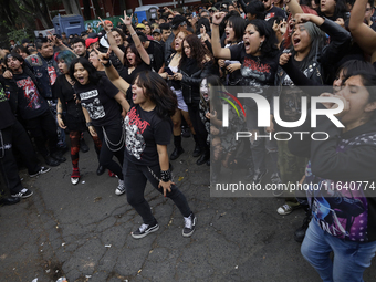 Young people dance during a concert to mark the 44th anniversary of the Tianguis Cultural del Chopo in Mexico City, Mexico, on October 5, 20...