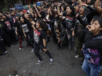 Young people dance during a concert to mark the 44th anniversary of the Tianguis Cultural del Chopo in Mexico City, Mexico, on October 5, 20...