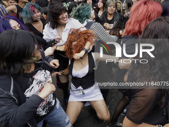 Young people dance during a concert to mark the 44th anniversary of the Tianguis Cultural del Chopo in Mexico City, Mexico, on October 5, 20...