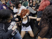 Young people dance during a concert to mark the 44th anniversary of the Tianguis Cultural del Chopo in Mexico City, Mexico, on October 5, 20...