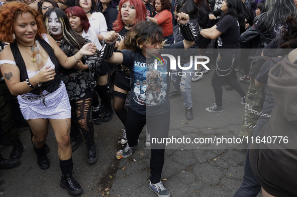 Young people dance during a concert to mark the 44th anniversary of the Tianguis Cultural del Chopo in Mexico City, Mexico, on October 5, 20...