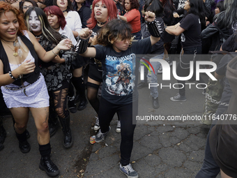 Young people dance during a concert to mark the 44th anniversary of the Tianguis Cultural del Chopo in Mexico City, Mexico, on October 5, 20...