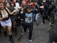 Young people dance during a concert to mark the 44th anniversary of the Tianguis Cultural del Chopo in Mexico City, Mexico, on October 5, 20...