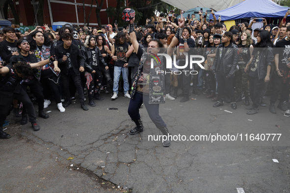 Young people dance during a concert to mark the 44th anniversary of the Tianguis Cultural del Chopo in Mexico City, Mexico, on October 5, 20...