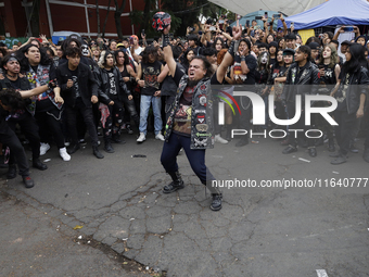 Young people dance during a concert to mark the 44th anniversary of the Tianguis Cultural del Chopo in Mexico City, Mexico, on October 5, 20...