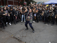 Young people dance during a concert to mark the 44th anniversary of the Tianguis Cultural del Chopo in Mexico City, Mexico, on October 5, 20...