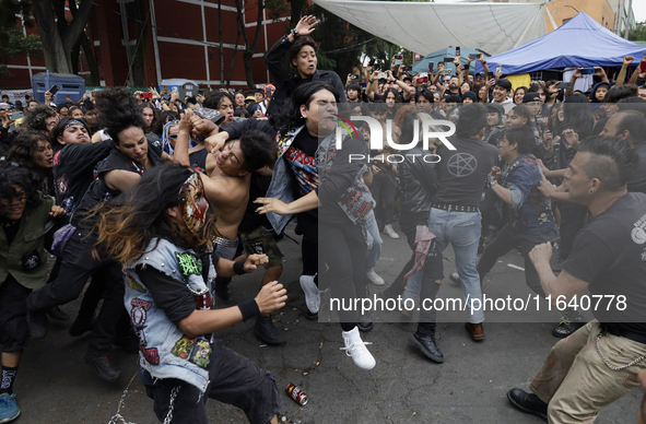 Young people dance during a concert to mark the 44th anniversary of the Tianguis Cultural del Chopo in Mexico City, Mexico, on October 5, 20...