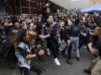 Young people dance during a concert to mark the 44th anniversary of the Tianguis Cultural del Chopo in Mexico City, Mexico, on October 5, 20...