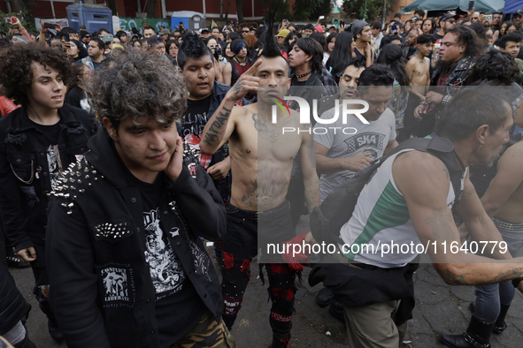 Young people dance during a concert to mark the 44th anniversary of the Tianguis Cultural del Chopo in Mexico City, Mexico, on October 5, 20...