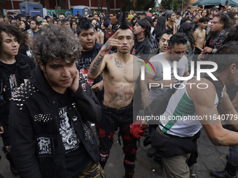 Young people dance during a concert to mark the 44th anniversary of the Tianguis Cultural del Chopo in Mexico City, Mexico, on October 5, 20...