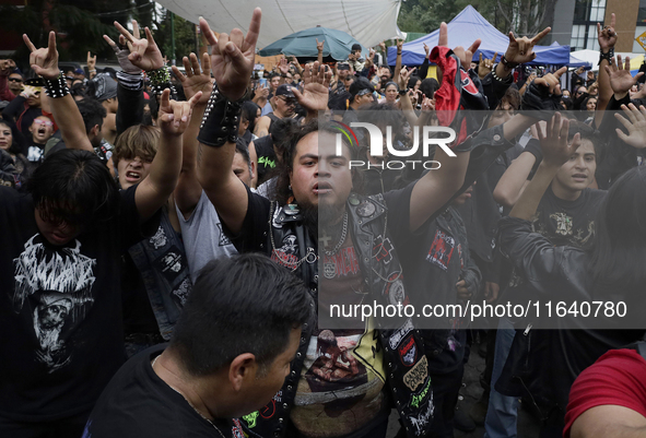 Young people dance during a concert to mark the 44th anniversary of the Tianguis Cultural del Chopo in Mexico City, Mexico, on October 5, 20...