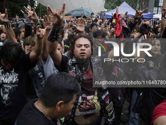 Young people dance during a concert to mark the 44th anniversary of the Tianguis Cultural del Chopo in Mexico City, Mexico, on October 5, 20...