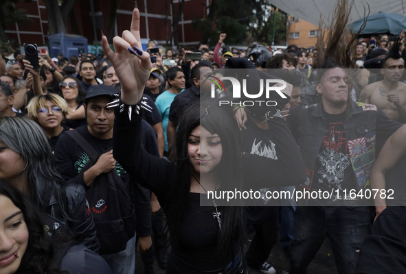 Young people dance during a concert to mark the 44th anniversary of the Tianguis Cultural del Chopo in Mexico City, Mexico, on October 5, 20...