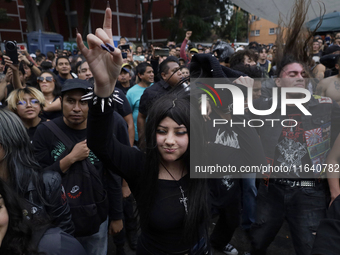 Young people dance during a concert to mark the 44th anniversary of the Tianguis Cultural del Chopo in Mexico City, Mexico, on October 5, 20...