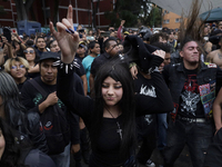 Young people dance during a concert to mark the 44th anniversary of the Tianguis Cultural del Chopo in Mexico City, Mexico, on October 5, 20...