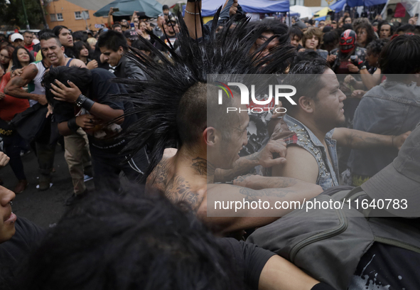 Young people dance during a concert to mark the 44th anniversary of the Tianguis Cultural del Chopo in Mexico City, Mexico, on October 5, 20...