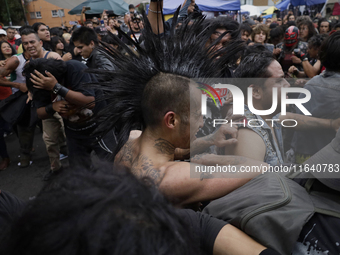 Young people dance during a concert to mark the 44th anniversary of the Tianguis Cultural del Chopo in Mexico City, Mexico, on October 5, 20...