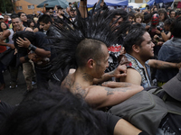 Young people dance during a concert to mark the 44th anniversary of the Tianguis Cultural del Chopo in Mexico City, Mexico, on October 5, 20...