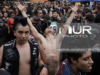 Young people dance during a concert to mark the 44th anniversary of the Tianguis Cultural del Chopo in Mexico City, Mexico, on October 5, 20...