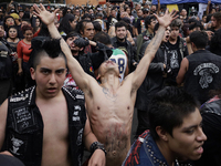 Young people dance during a concert to mark the 44th anniversary of the Tianguis Cultural del Chopo in Mexico City, Mexico, on October 5, 20...