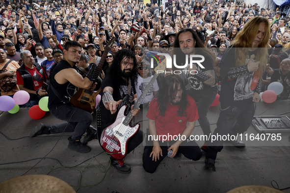 Members of the band Transmetal take a photo at the end of the concert on the occasion of the 44th anniversary of the Tianguis Cultural del C...