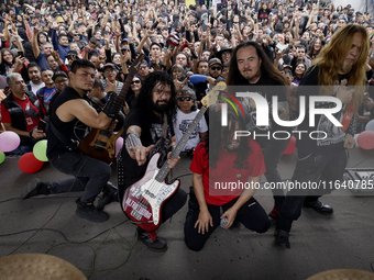 Members of the band Transmetal take a photo at the end of the concert on the occasion of the 44th anniversary of the Tianguis Cultural del C...