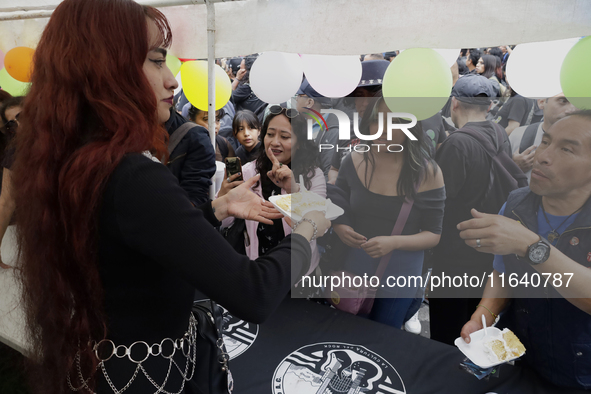 Cake is distributed during a concert on the occasion of the 44th anniversary of the Tianguis Cultural del Chopo in Mexico City, Mexico, on O...