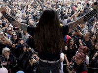 Young people dance during a concert to mark the 44th anniversary of the Tianguis Cultural del Chopo in Mexico City, Mexico, on October 5, 20...