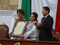 Clara Brugada Molina receives the certificate that endorses her as Head of Government of Mexico City during the swearing-in ceremony at the...